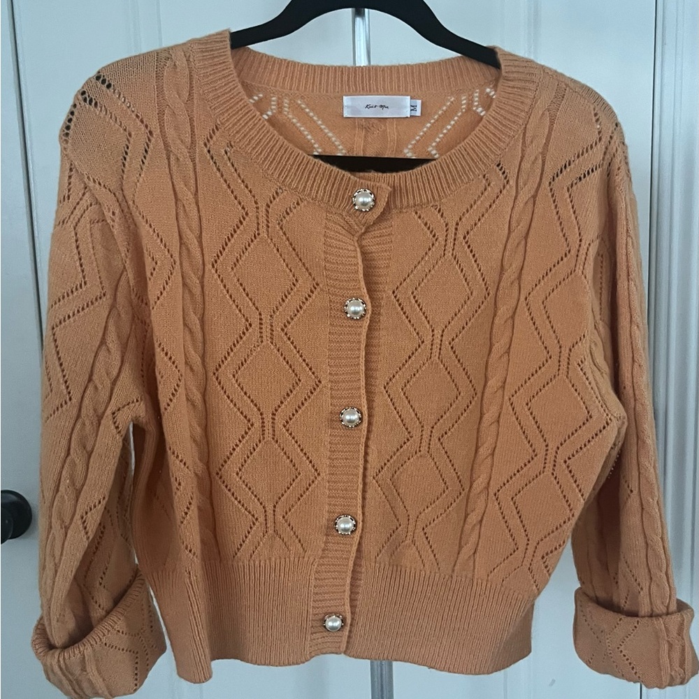 Super pretty cardigan with pearl button detail.